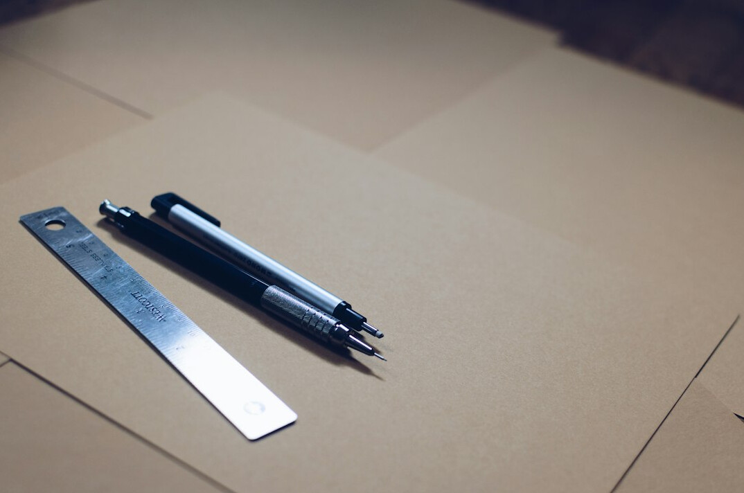 Documents and papers on a desk with a pen