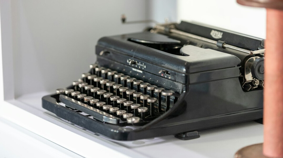Vintage typewriter with a sheet of paper