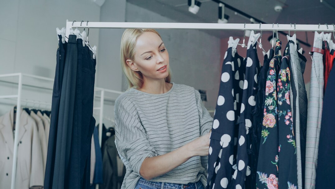 woman shoplifting clothes